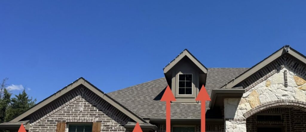 Soffit-to-shingle junctions across the front roofline, the points marked for sealing before winter.