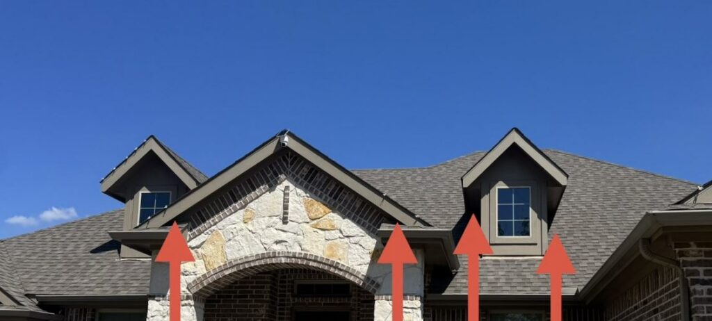 Roofline of a McKinney home with arrows marking gaps between the soffit and the shingles where rodents can enter the attic.